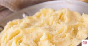 Mashed potatoes in a stainless steel dish. This article share a Whole30 mashed potatoes recipe.