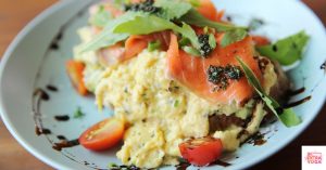 Eggs, tomatoes, and salmon on whole wheat bread. This article discusses what a hormone balancing meal plan is.