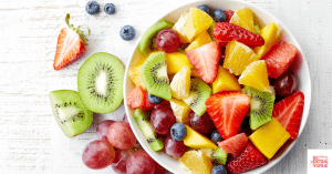 Fruit salad in a bowl. This article discusses the best elimination diet desserts.