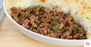 Shepherd's pie in a white dish. This articles shares a recipe for paleo Shepherd's Pie.