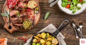 A meal on the table including steak, potatoes, and salad. This article shares paleo dinner recipes.